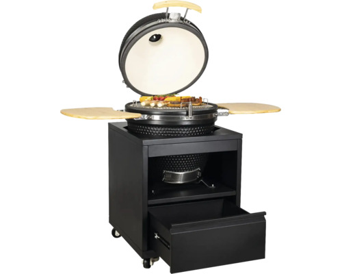 Gril Kamado en céramique avec couvercle ouvert sur un chariot métallique mobile avec tiroir et tablettes latérales en bois.