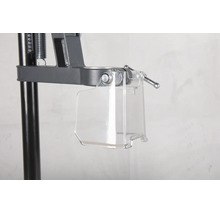 Protection transparente contre les copeaux sur un support de perceuse en métal.