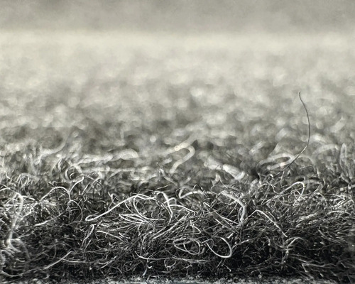 Gros plan de fibres de tapis avec une surface texturée.