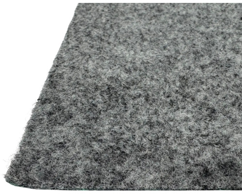 Gros plan sur une surface en feutre aiguilleté gris pour revêtements de sol ou tapis de protection.