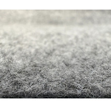 Gros plan de la structure de surface d'une moquette en feutre aiguilleté.
