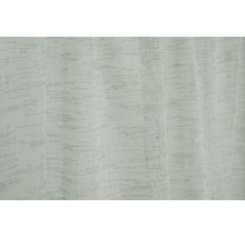Gros plan sur le tissu de rideau structuré gris clair avec un motif tissé.