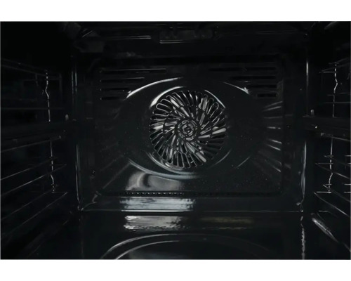 Vue intérieure d'un four avec ventilateur à convection sur la paroi arrière et rails de support latéraux.
