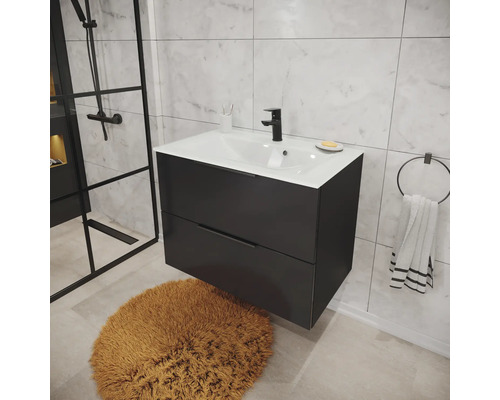 Meuble sous-vasque moderne suspendu anthracite avec deux tiroirs et lavabo blanc dans une salle de bain avec carrelage aspect marbre.