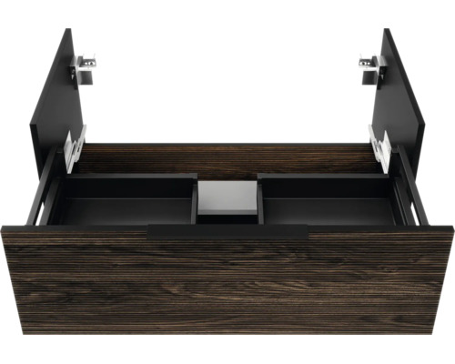 Tiroir ouvert d'un meuble sous-vasque avec découpe pour siphon, aspect bois et intérieur noir.
