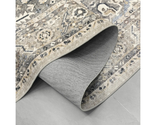 Teppich mit Vintage-Muster und strukturierter, rutschhemmender Rückseite.
