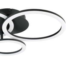 Plafonnier LED moderne noir et blanc avec anneaux superposés en métal et plastique.