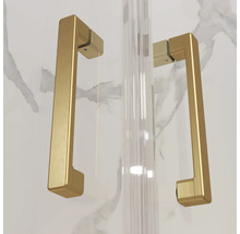 Poignées de porte rectangulaires en métal doré pour cabines de douche en verre.