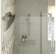 Paroi de douche moderne en verre avec barre de stabilisation et étagère de douche intégrée dans une salle de bain carrelée.