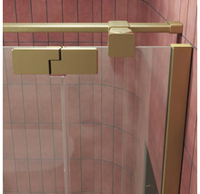 Profil de cabine de douche en métal avec charnière sur paroi de douche en verre transparent devant un mur carrelé