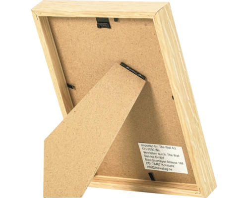 Vue arrière d'un cadre photo en bois avec support et clips métalliques pour la fixation.