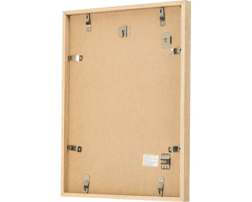 Vue arrière d un cadre photo rectangulaire en bois avec pinces métalliques et supports de suspension
