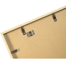 Dos d'un cadre photo en bois avec attaches métalliques et ressorts de fixation