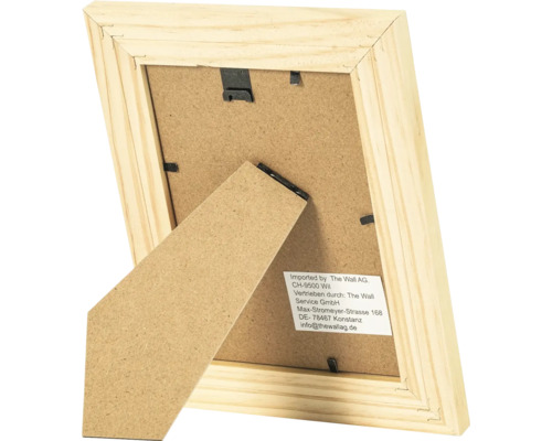 Vue arrière d un cadre photo en bois avec support et clips métalliques