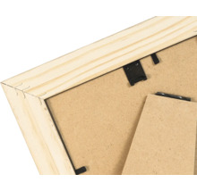 Dos d'un cadre photo en bois avec support et pinces métalliques