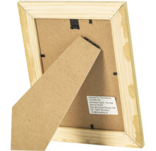 Vue arrière d un cadre photo en bois avec support et clips de fixation en métal.