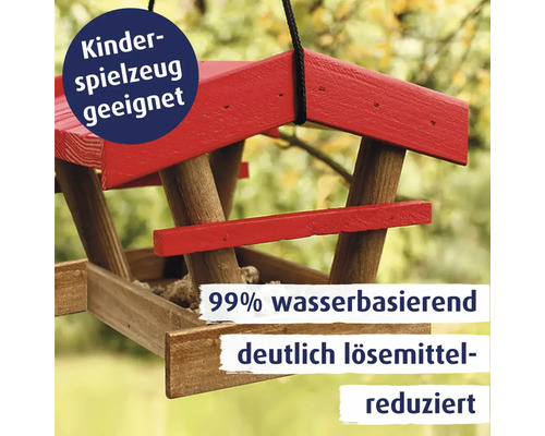 Ein hängendes Vogelhaus aus Holz mit Informationen zur Eignung für Kinderspielzeug und reduziertem Lösungsmittelgehalt.