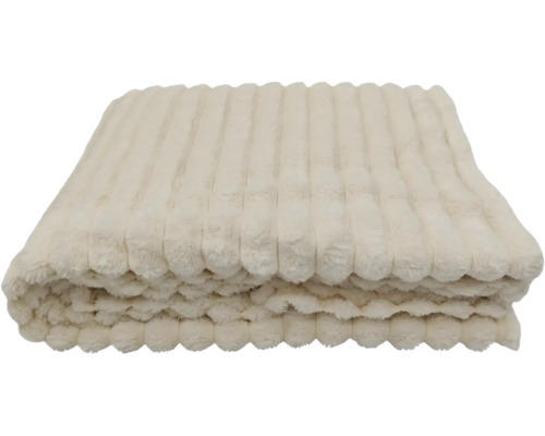 Eine gefaltete Wohndecke aus weichem Plüsch mit gerippter Struktur.