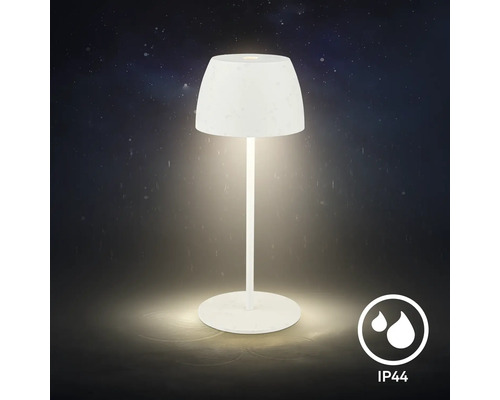 Moderne LED Tischleuchte fuer den Aussenbereich mit IP 44 Schutz gegen Spritzwasser vor dunklem Hintergrund.