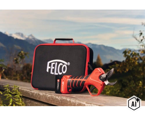 FELCO Akku Schere mit Transportkoffer vor einer Berglandschaft. (Image AI modified or generated)