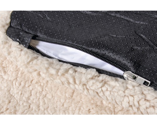 Vue détaillée d''un lit pour chien avec fermeture éclair et dessous antidérapant