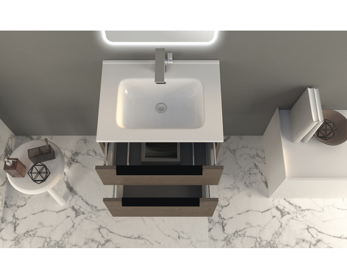 Badezimmer Waschbeckenunterschrank mit Schubladen in hellem Holz und weißem Waschbecken