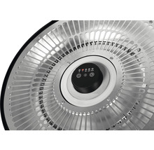 Gros plan d''un chauffage de terrasse avec commandes et grille de protection.