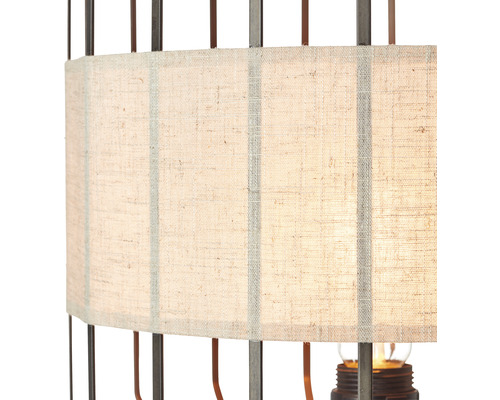Gros plan d''une lampe de table avec abat-jour en tissu et cadre en métal