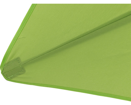 Gros plan d''un parasol vert avec revêtement en tissu