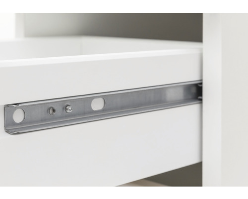 Gros plan d''un coulisseau de tiroir métallique sur un tiroir blanc