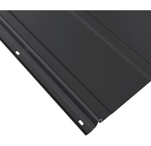 Gros plan d''une plaque métallique profilée noire.