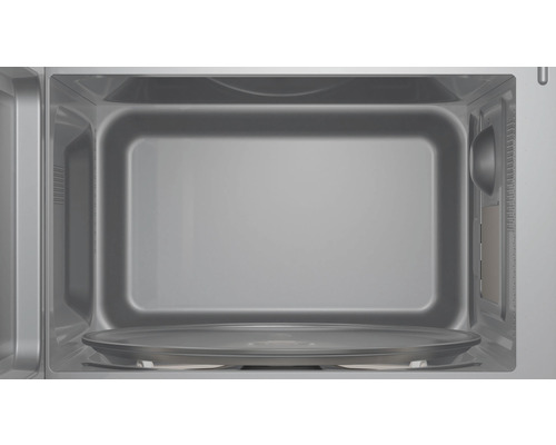 Intérieur d''un micro-ondes avec plateau tournant