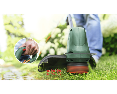 Coupe-bordures en cours d''utilisation pour couper l''herbe