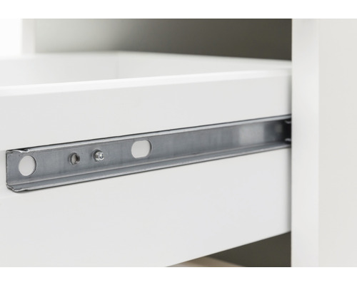 Gros plan d''une coulisse de tiroir en métal sur un meuble blanc