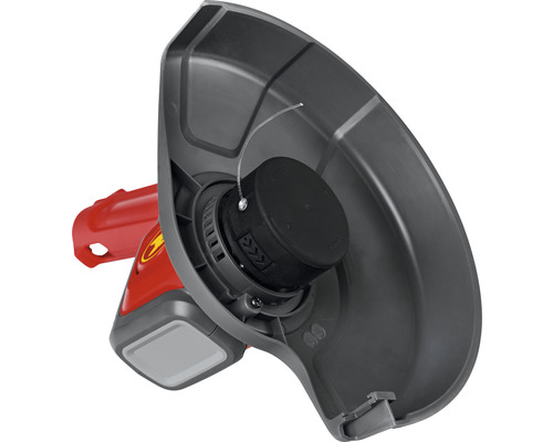 Gros plan d''un coupe-bordure avec dispositif de protection et fil de coupe