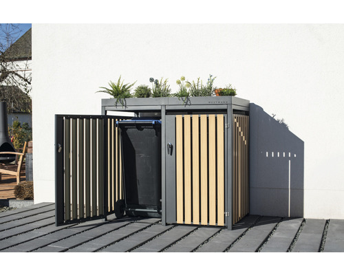 Cache-conteneur avec des plantes sur le toit et une poubelle