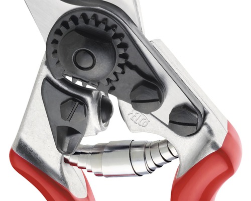 Gros plan d''un sécateur avec mécanisme à engrenages et ressort