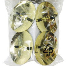 Quatre patins pour meubles dorés dans un sac en plastique transparent