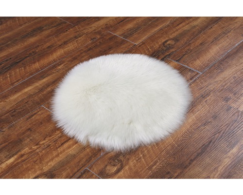 Tapis rond blanc sur parquet