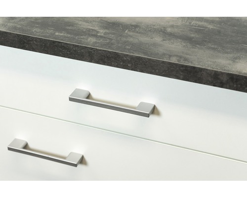 Vue détaillée d''un meuble de salle de bains avec deux tiroirs, un plan de travail et des poignées