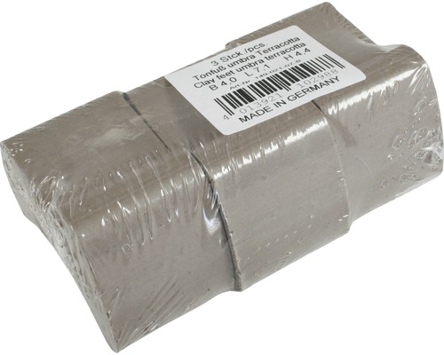 Drei Tonfüsse Umbra Terrakotta in Folie verpackt