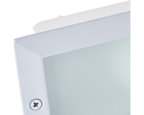 Gros plan d''une applique murale blanche avec vis