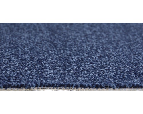 Gros plan d'un tapis bleu avec une structure bouclée.
