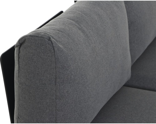 Gros plan d''un canapé gris avec revêtement en tissu et accoudoir