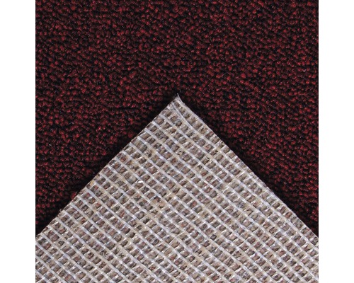 Gros plan d''un tapis avec une structure tissée au dos