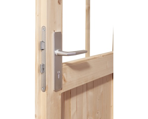 Detailansicht einer Holztür mit silberfarbenem Türgriff und Schlosskasten