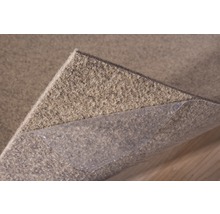 Protection antidérapante pour tapis avec film adhésif pour la fixation sur le support.