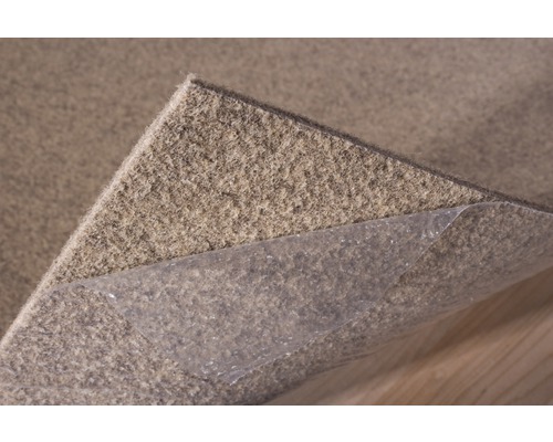 Protection antidérapante pour tapis avec film adhésif pour la fixation sur le support.