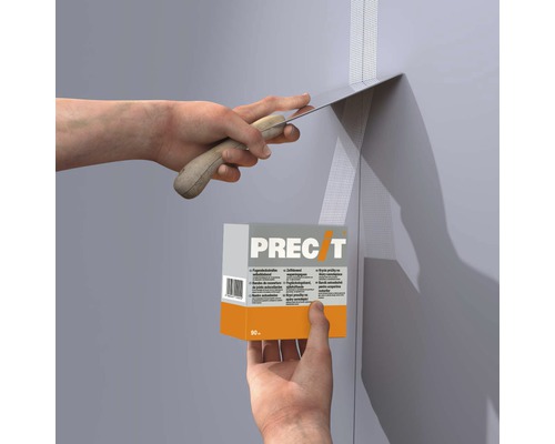 Application de bandes à joint avec une spatule et du mastic à joints