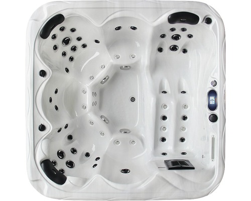Weisser Whirlpool mit mehreren Sitzen und Düsen.